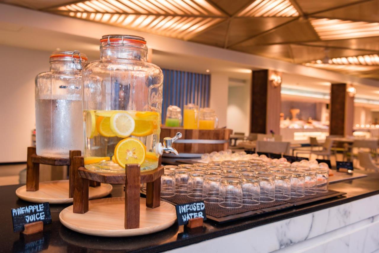 Oceanfront Beach Resort - Sha Extra Plus Patong Bagian luar foto Infused water at a buffet