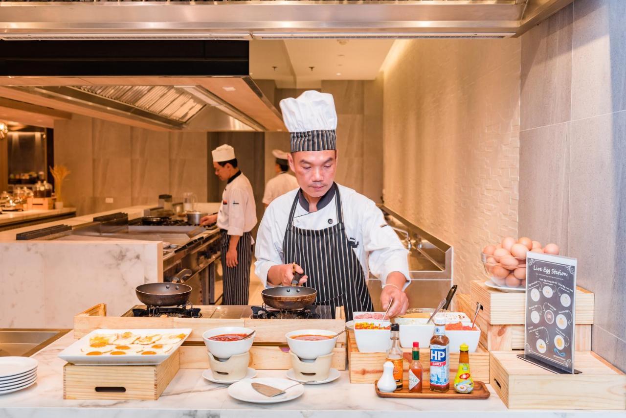 Oceanfront Beach Resort - Sha Extra Plus Patong Bagian luar foto A chef at work