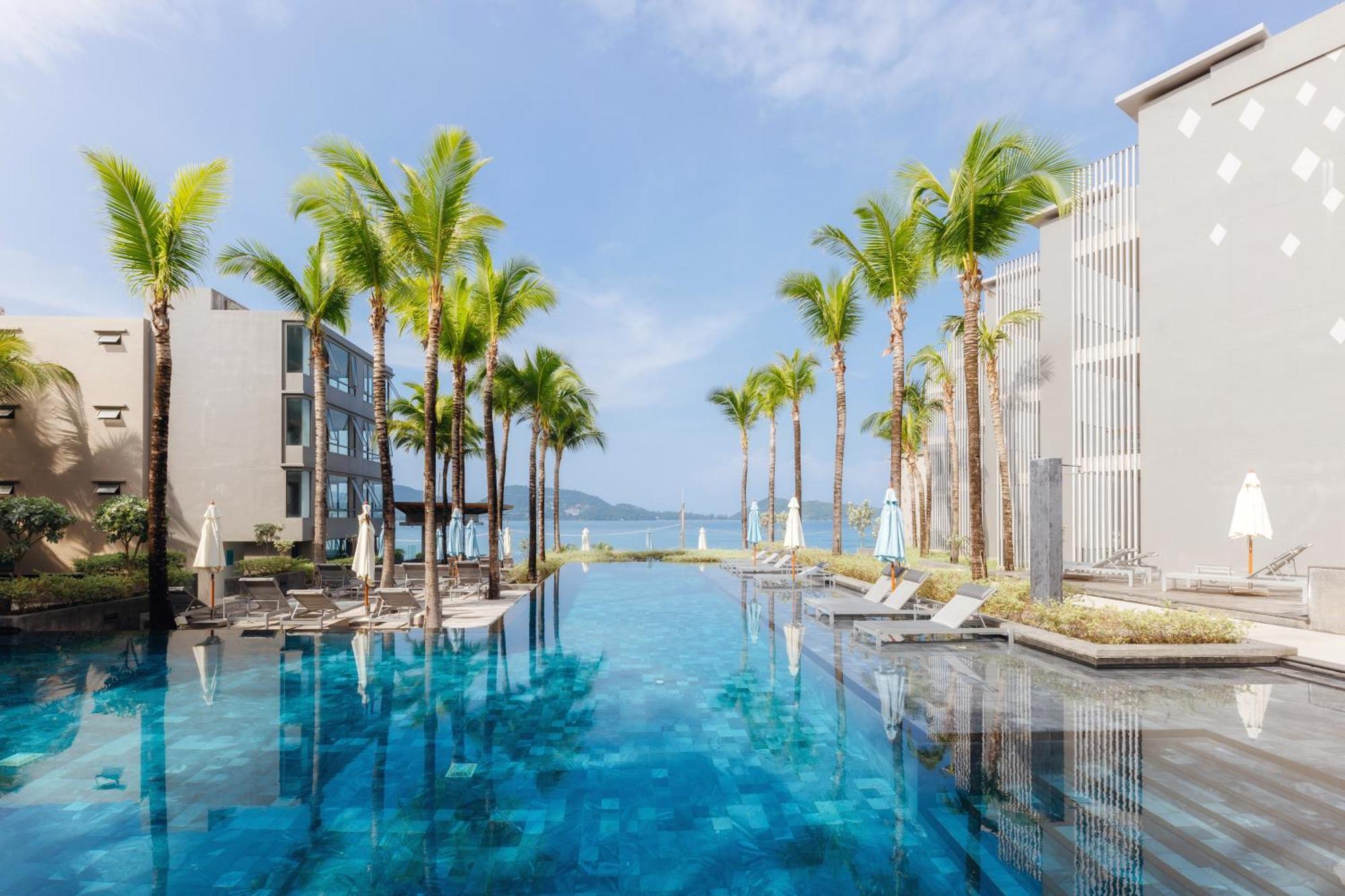 Oceanfront Beach Resort - Sha Extra Plus Patong Bagian luar foto The swimming pool at the hotel