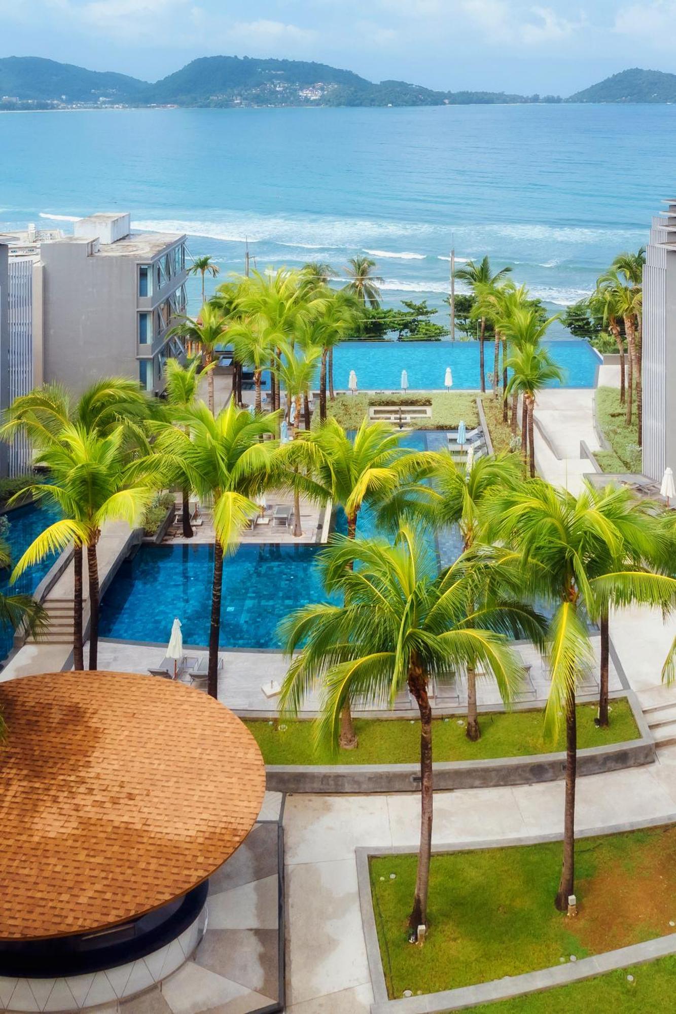 Oceanfront Beach Resort - Sha Extra Plus Patong Bagian luar foto The swimming pool at the resort