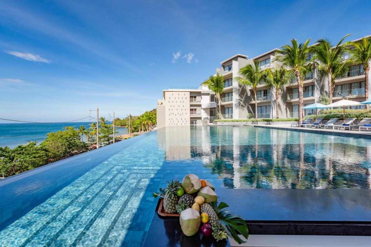 Oceanfront Beach Resort - Sha Extra Plus Patong Bagian luar foto The resort's infinity pool